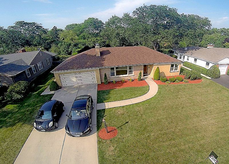 Ariel shot of front of house. : Newly landscaped.