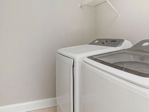 In unit washer and dryer. Washing machine has been updated to more reliable older model.