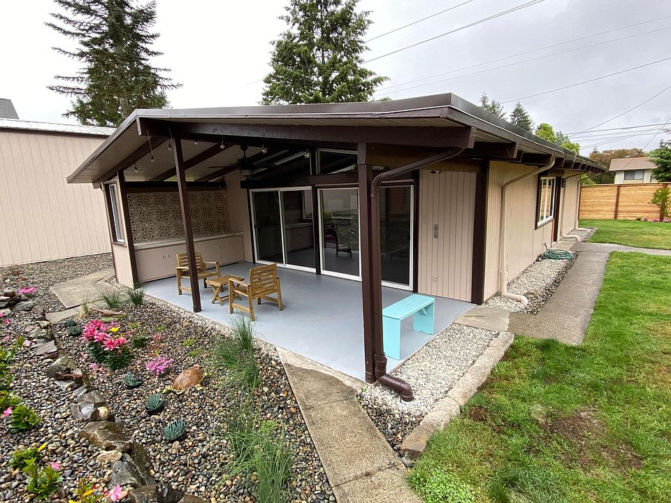 One level mid century rambler with privacy and great outdoor living space.