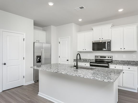 The kitchen comes with brand new stainless-steel appliances