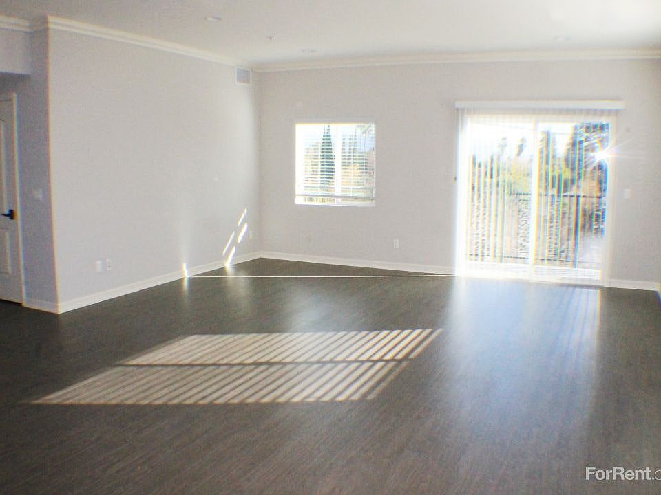 Open plan Living Room with HUGE East-facing balcony.