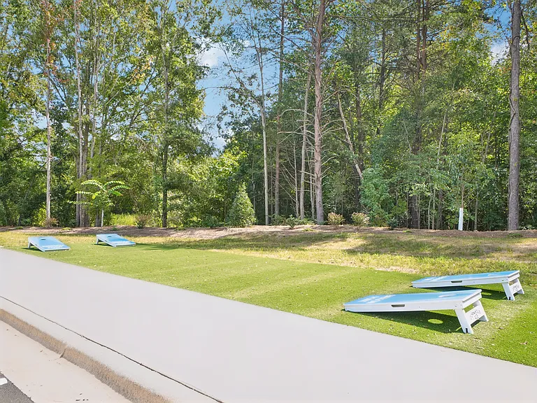 Cornhole and outdoor activity area at Emerson Point Apartments in Elon, NC