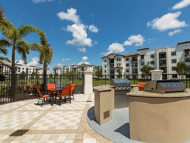 Lakeside outdoor living room with grilling stations