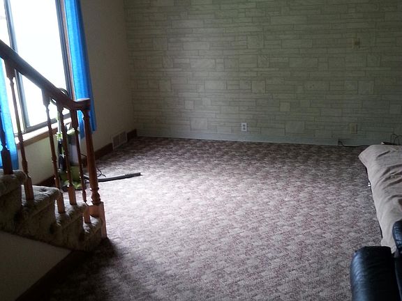 Main Level Living Room - Open Stairway and Large Living Space.