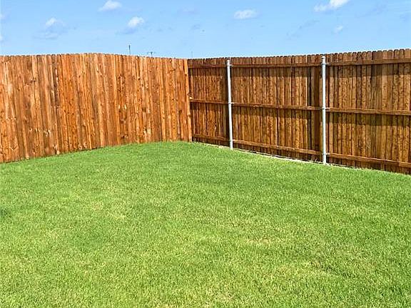 View of fenced backyard