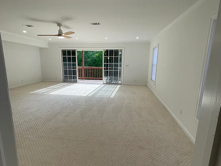 master suite with balcony, private bath and walk-in closet
