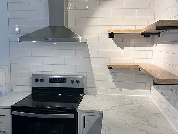Floating shelves and ample under counter storage