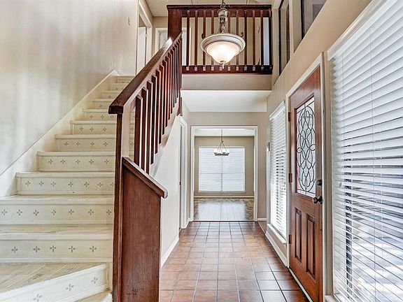 Beautiful saltillo tile entryway leads through to either the great room or dining room and bedrooms.  Lots of light from the gor
