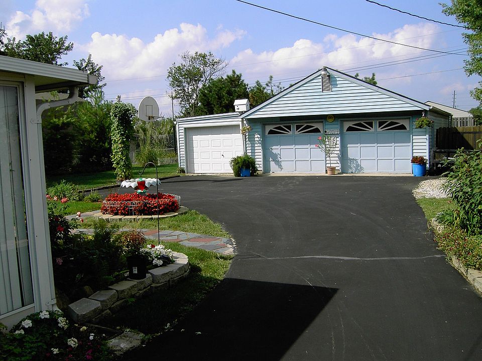 Private 7 Car Garage in Rear with Attic Storage!