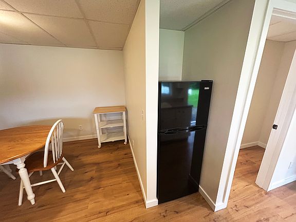 Dining area and refrigerator (opposite from the kitchen counter).
