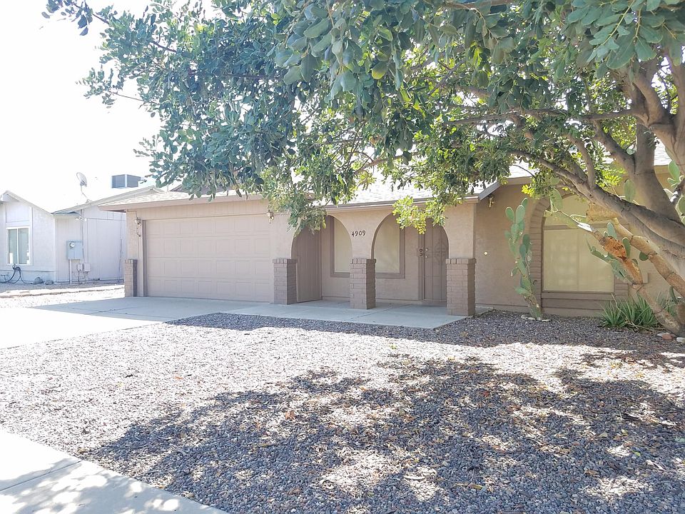 Front view with two car garage