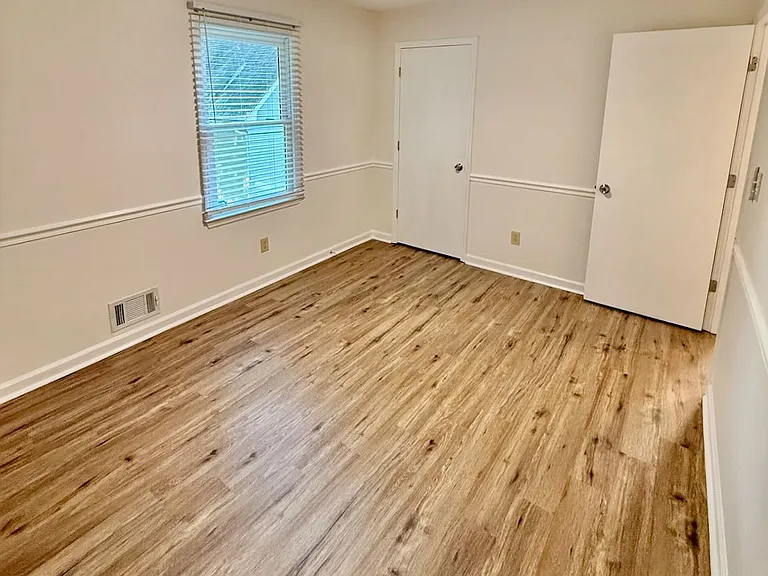 Versatile third bedroom_ new fan and matching new blinds create a comfortable, private spot - ready to serve as guest room, home office or cozy reading nook