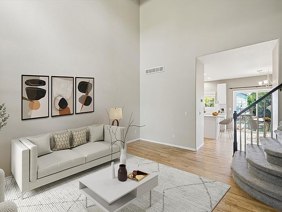 Entry with soaring ceilings and great natural light! (virtually staged)