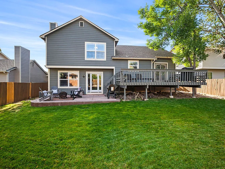 The spacious, fenced-in backyard offers the perfect setting to savor delightful moments with friends and family.