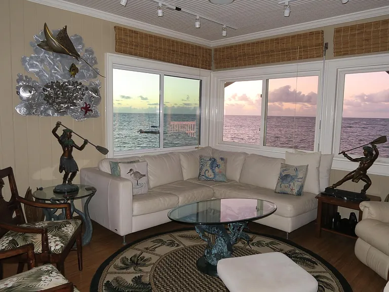 LIving room have a 180 degree view of the ocean.