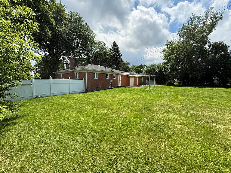 Rear Fenced Yard with Sun Shade