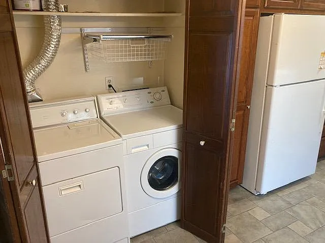 Washer and dryer with folding doors to hide