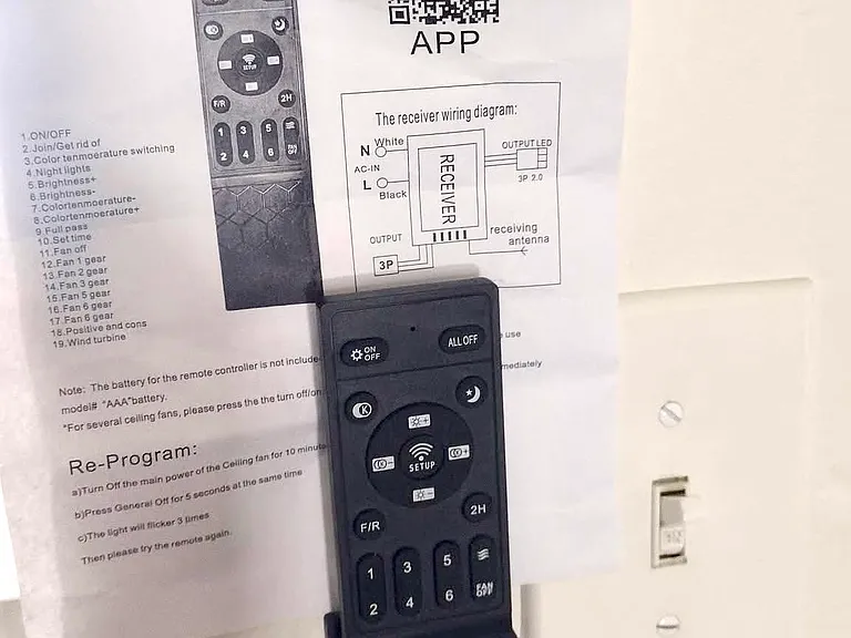 Ceiling fan remote with app instructions.