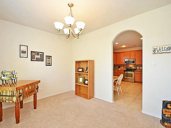 It is located off the kitchen & breakfast room. Notice the beautiful arched entry. You'll find those