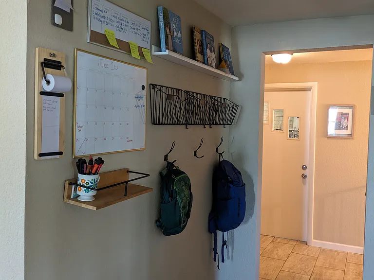 Hallway leading to the garage and downstairs