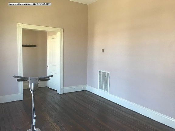 Huge living room with big windows and freshly finished hardw