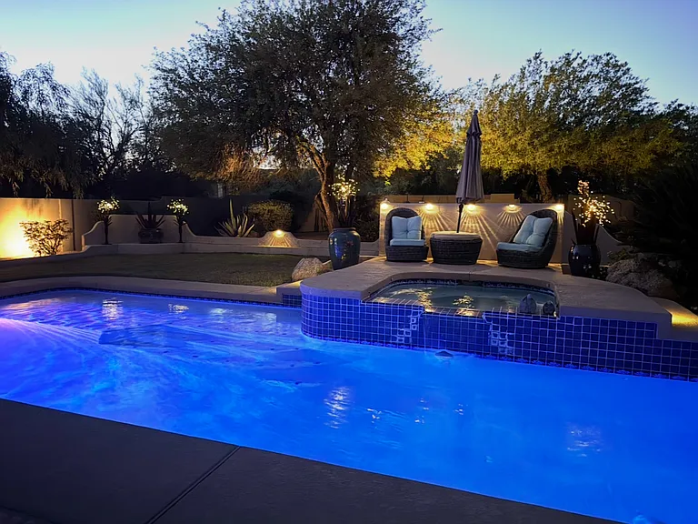 Night time shot of backside of property