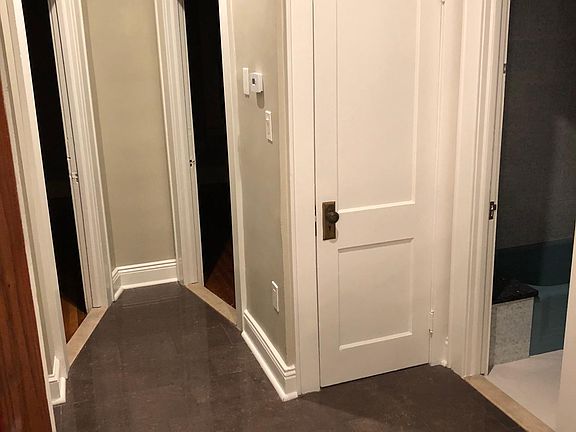 Hallway between two bedroom and bathroom