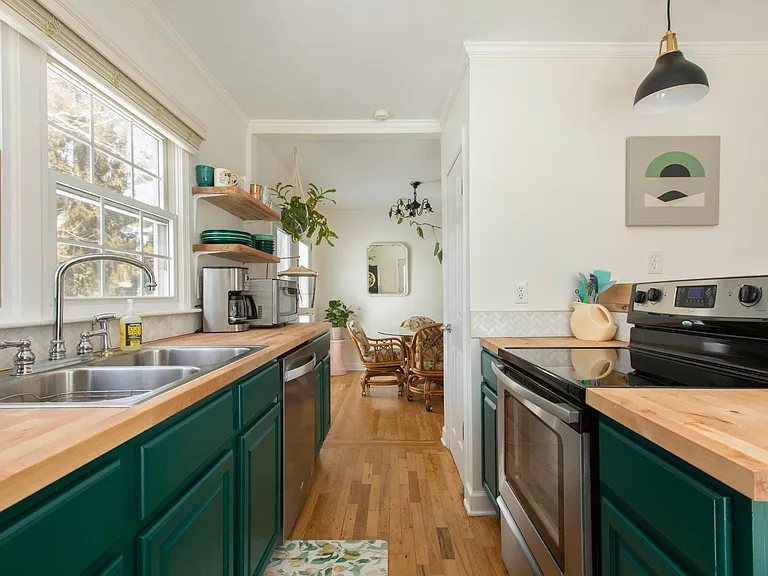Galley style kitchen. Doorway to the right opens to a pantry.