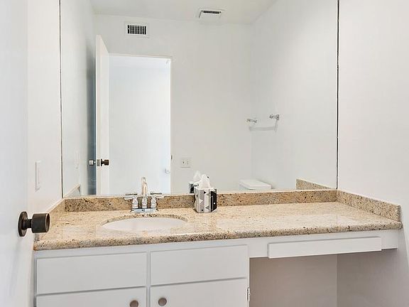 Downstairs guest bathroom (between garage and entry)