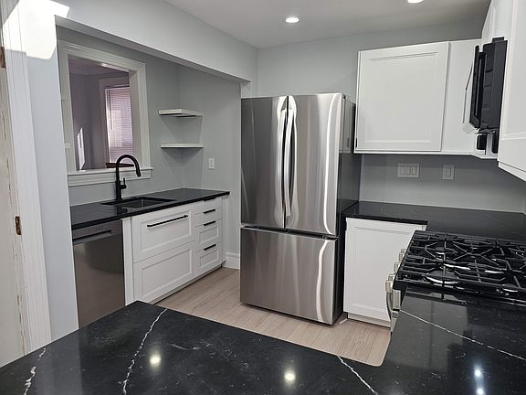 Brand New Cabinets, Appliances, Floors, Paint.