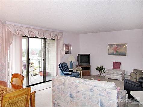 Spacious living room with view covered deck