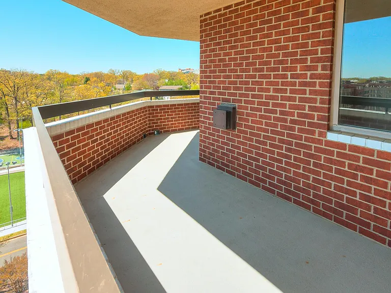 Wrap-around balcony overlooks pool and Rocky Run Park