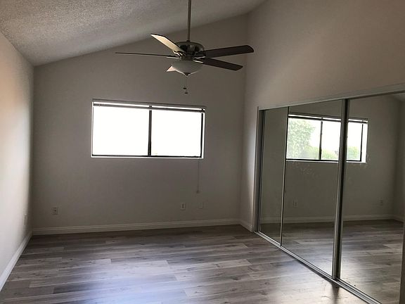 Vaulted ceiling and Triple wide mirrored closet makes this Large Master Suite feel huge.