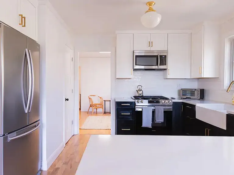 Kitchen looking into den