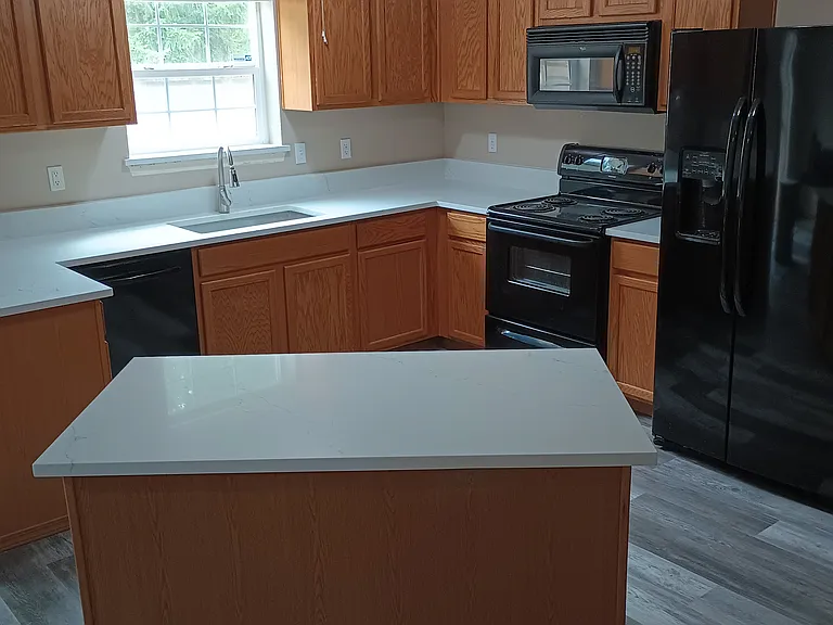 Recently updated flooring and countertops in kitchen, dining room and pantry