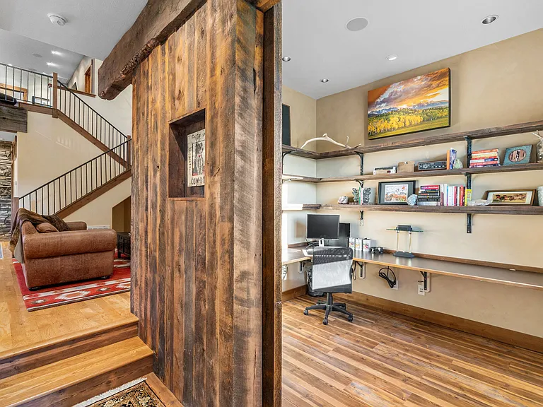 Dedicated office space with ample storage and huge reclaimed sliding door.