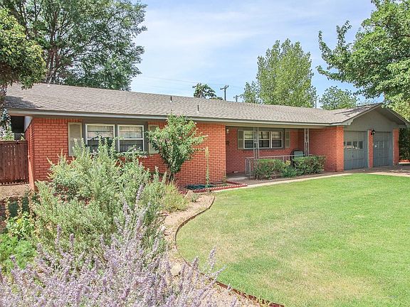 The front of the house has beautiful, established landscaping.