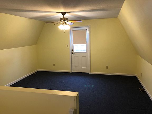 Second floor bedroom with door to deck