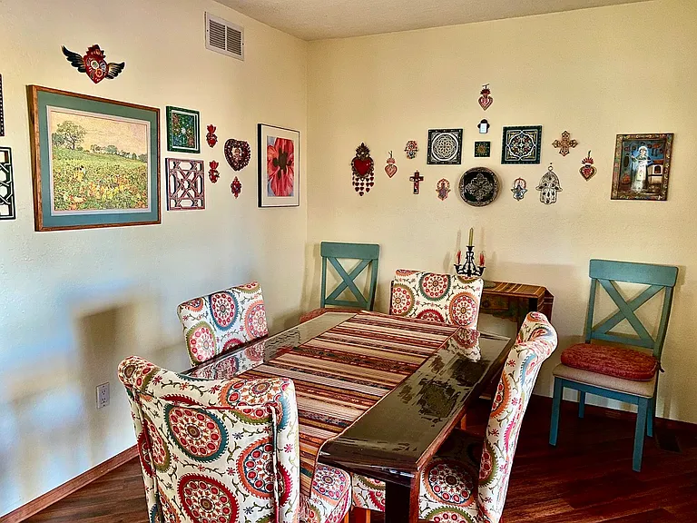 There's a leaf for the table in the guest bedroom closet, so that the table sits 6 comfortably.