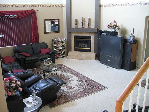 Family Room w/ Fireplace : gas fireplace with on/off switch on the wall, 4 large windows, mountain v