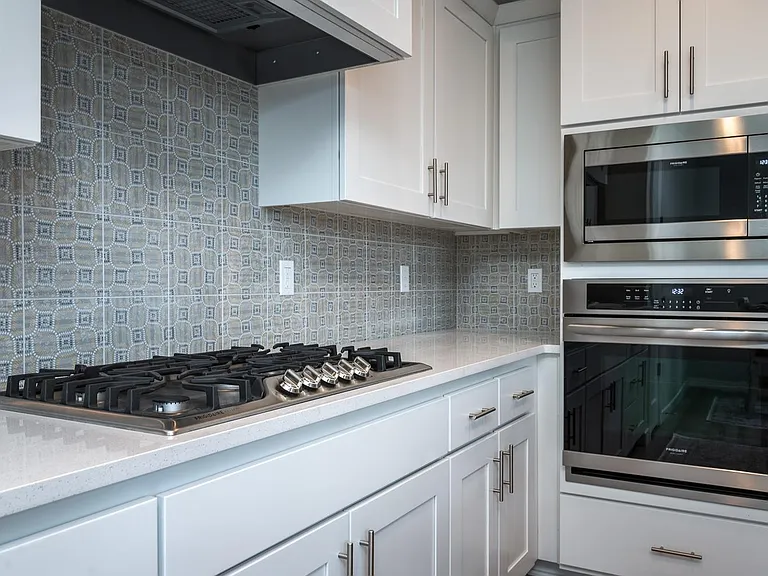 upgraded kitchen with wall oven and cooktop