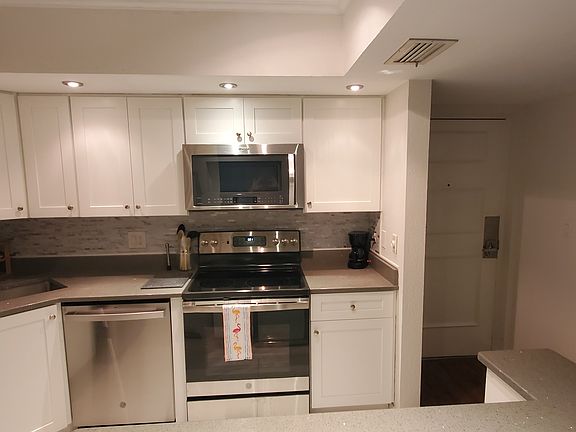 Fully updated kitchen with stainless steel appliances, quarts counters & ceramic tile flooring.