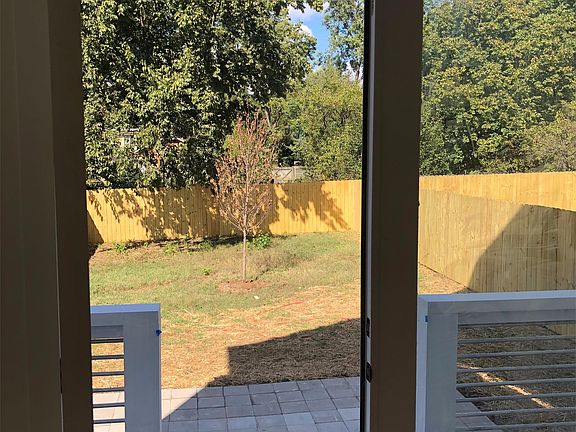 Off living room double doors out to back deck, patio and fenced in yard.