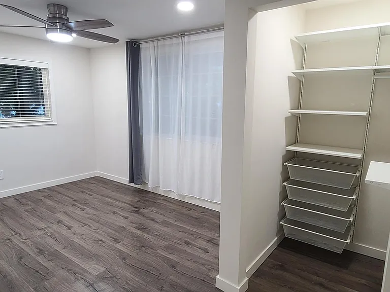Corner Bedroom with walk-in closet and 2 windows