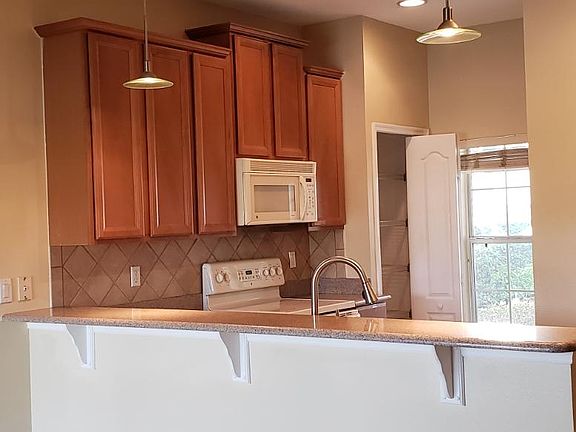 Granite kitchen with living area.