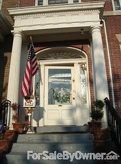 Front door
						:
						Stained glass windows around door.