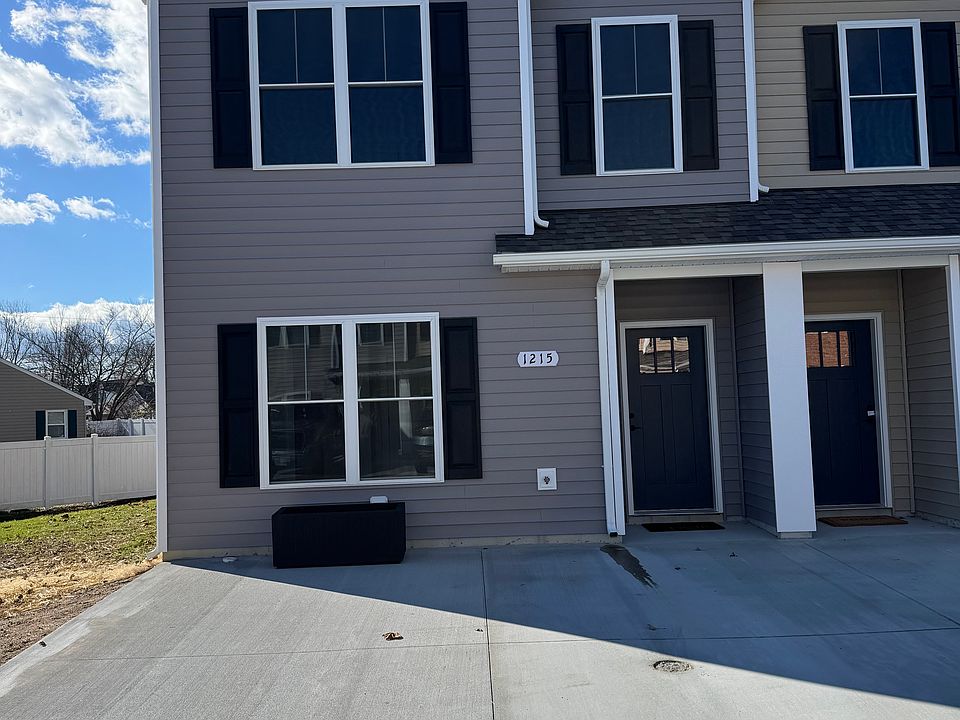 Front of end unit townhouse with 2 parking spaces