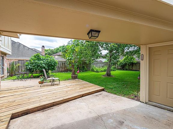 Covered walkway from garage to house