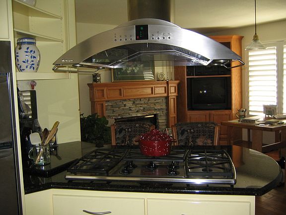 The kitchen is open to the family room with an inviting fireplace.