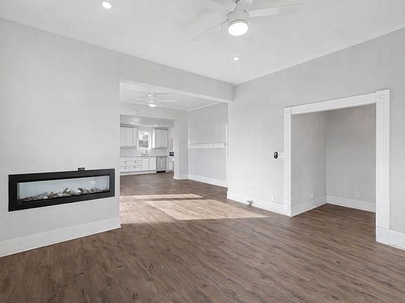 View of front room. Fireplace is double-sided